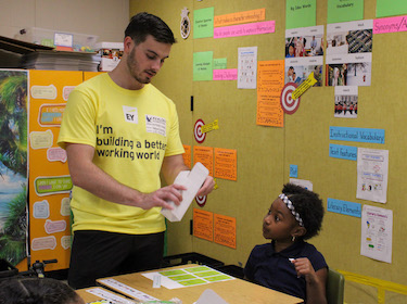 Ernst and Young staff working with Avalon student
